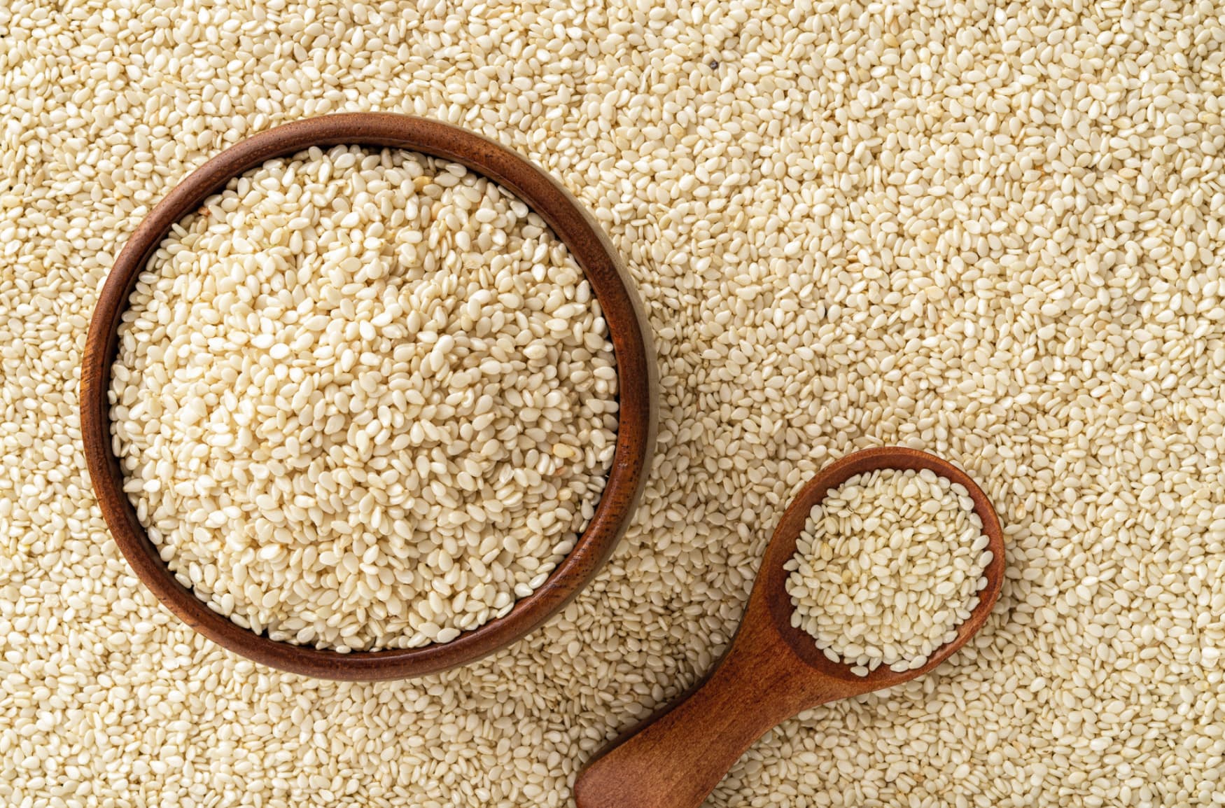 Bowl and spoon of sesame seeds